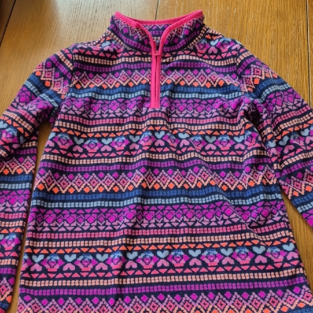 Colorful Patterned Pullover with Pink Accents